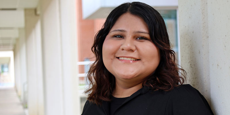 Applications programming student Evelyn Zuniga studying on her laptop.