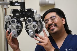 Eye care technology program student in college lab