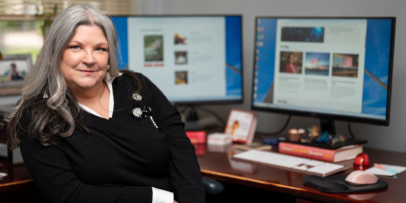 Carrie Taylor seated at her office